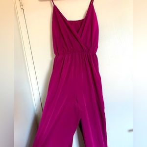 ASOS burgundy jumpsuit with V wrap front and adjustable straps.